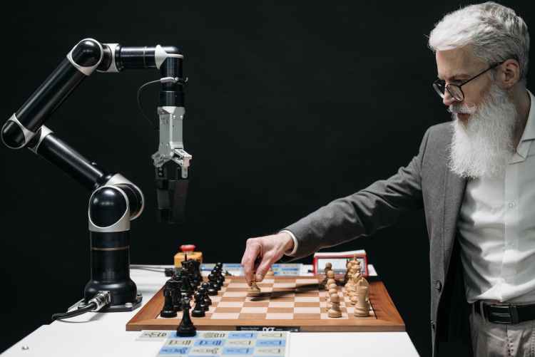 a bearded man playing chess with AI