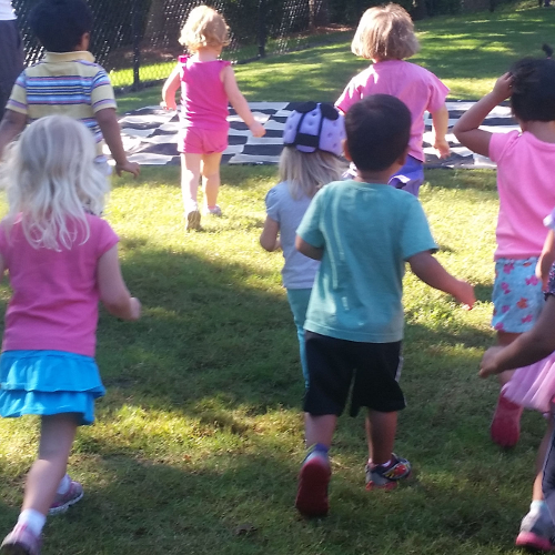 Young preschool students learning chess through active movement with Smart Moves Chess
